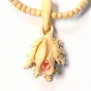 1940’s handmade beaded vintage necklace with hand carved celluloid pendant.